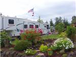 View larger image of Fifth wheel parked near gorgeous landscaping at ELMA RV PARK image #8