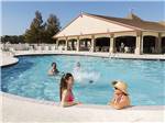 View larger image of People playing in the pool at COUSHATTA LUXURY RV RESORT AT RED SHOES PARK image #11