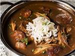 View larger image of A bowl of seafood gumbo at COUSHATTA LUXURY RV RESORT AT RED SHOES PARK image #12