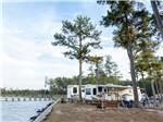 Two travel trailers parked by the waterfront at SUN OUTDOORS CHESAPEAKE BAY - thumbnail