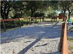 The fenced in pet area at WHISPERING OAKS RV PARK - thumbnail
