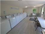 View larger image of Inside of the clean  modern laundry room at COLORADO LANDING RV PARK image #4