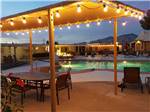 View larger image of Swimming pool with outdoor seating at FAR HORIZONS RV RESORT image #9