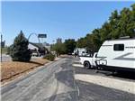 The road behind the paved sites at DRAFTKINGS AT CASINO QUEEN RV PARK - thumbnail