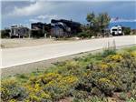 View larger image of A paved road leading to the RV sites at SANTA FE SKIES RV PARK image #10