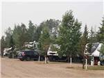 View larger image of A row of gravel RV sites at COUNTRY ROADS RV PARK image #2