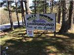 Welcome sign at Tall Pines Campground - thumbnail