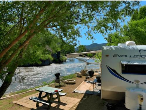 Parked trailer at site Four Seasons RV Resort