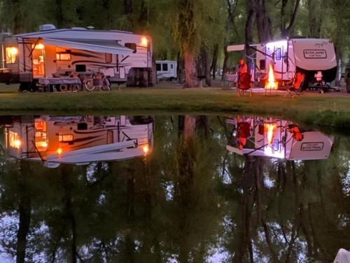 RVs reflecting off the water at night