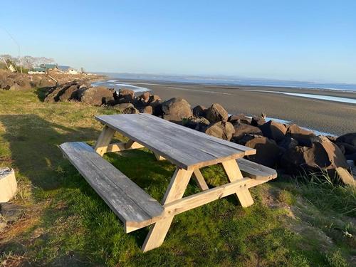 A picnic table by the beach