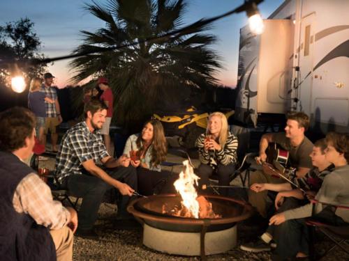 People by the firepit at Arizona Oasis RV Resort