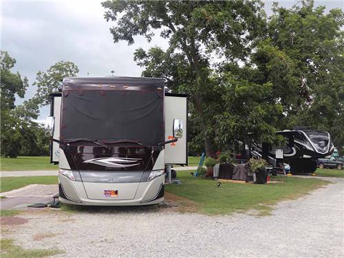 A motorhome parked in an RV site at CECIL BAY RV PARK I-75