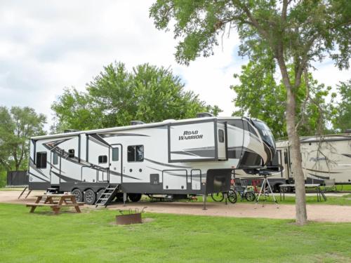 Parked travel trailer at site Texas Wine Country Jellystone Park Camp-Resort