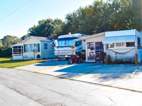 Mobile homes and RV parked at Tropical Gardens RV Park