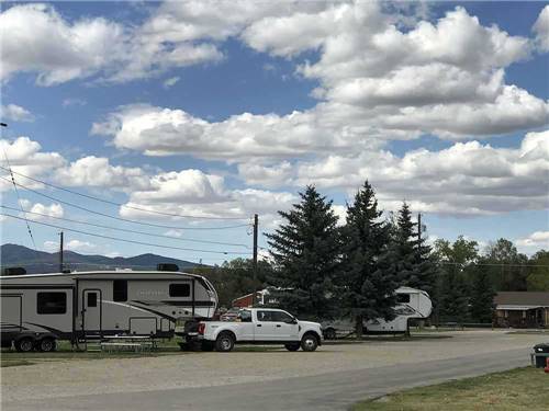 A road in front of gravel RV sites at MOUNTAIN ACRES RV PARK