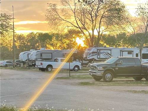 A row of gravel RV sites at WAGONS WEST RV PARK AND CAMPGROUND
