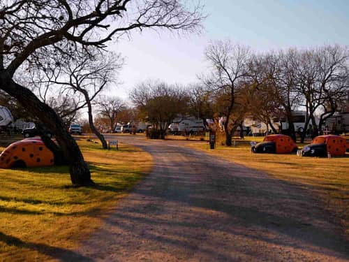 Road through campground lots with RVs