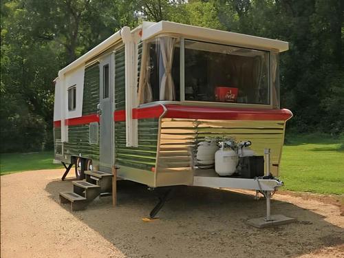 Vintage trailer parked at site Glacier Valley Campground