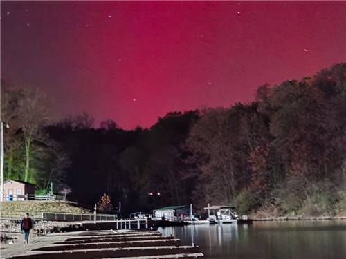 Red Northern Lights over the lake