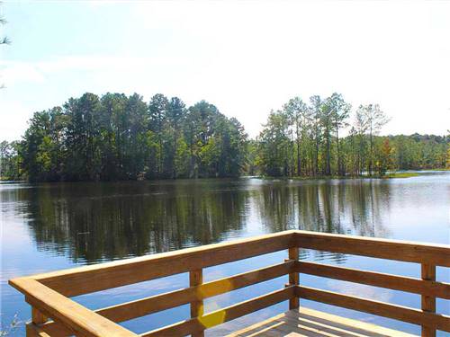 Wooden platform overlooking broad lake at LAKE JASPER RV VILLAGE