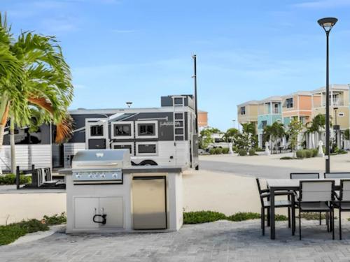 BBQ with seating area at site Sun Outdoors Islamorada