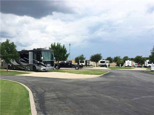 Large swimming pool with blue lounge chairs at SHADY CREEK RV PARK AND STORAGE