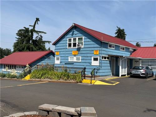 Exterior of the blue office with red roof