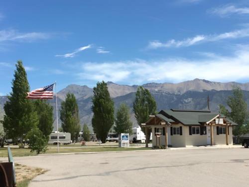 Campground building with RV sites in background