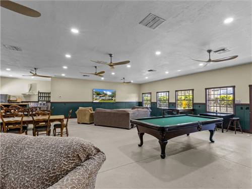 A billiard table and seating in the rec hall