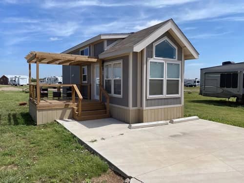A cabin with a wooden porch
