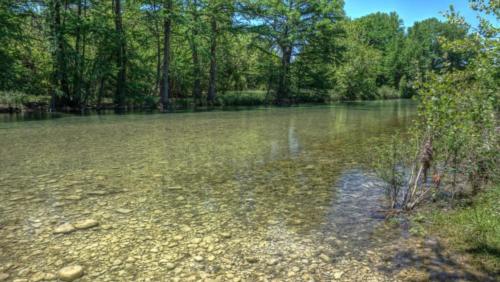 Lake near woods at site Camp Riverview