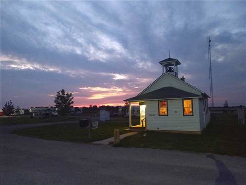 View of main office at dusk at LIGHTHOUSE LANDING RV PARK & CABINS