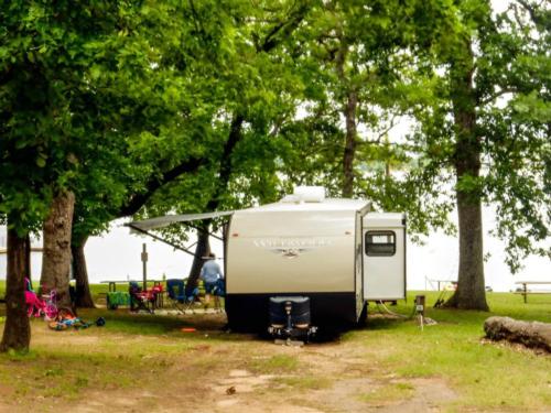 Camper by the trees at Shiloh on the Lake