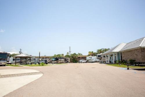 Parked RV's and trailers at site Gulf Beach RV Resort