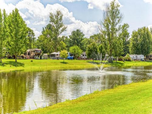 View of RV sites by the water at Northwoods RV Resort
