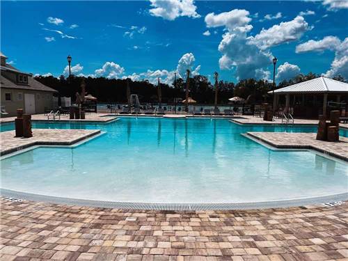 The swimming pool area at ISLAND OAKS RV RESORT