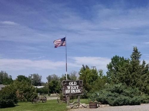 An American flag flies at the entrance at Old West RV Park