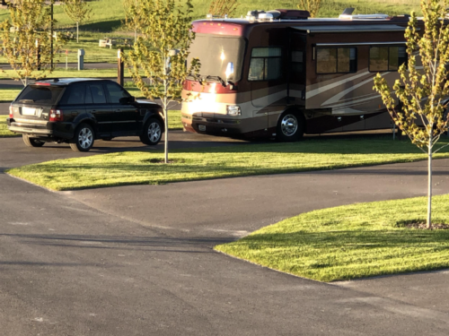 RV and black SUV in site at Montana Basecamp