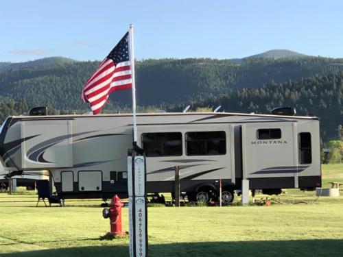 Trailer in a grassy RV site