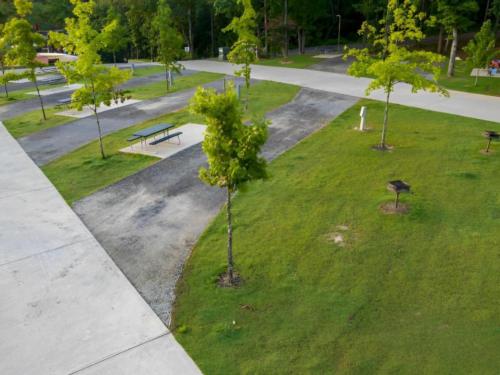 Paved site by the grass