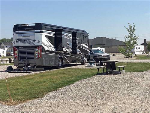 Class A Motorhome parked at site at YELLOWSTONE LAKESIDE RV PARK