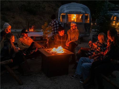 A group gathred around a campfire