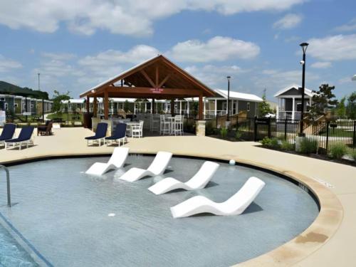 Louge chairs by the pool at Redbud Ranch RV Resort