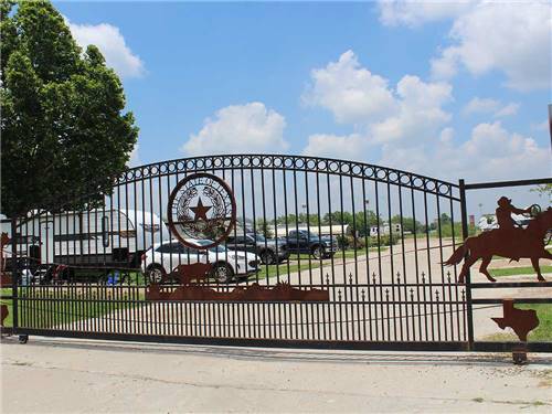The front metal gate entrance at CREEKSIDE RV RANCH