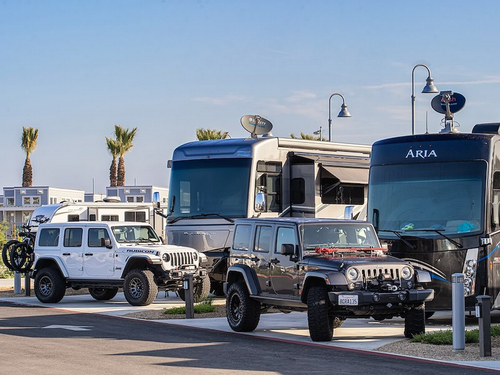 Jeeps next to rigs at Sun Outdoors San Diego Bay