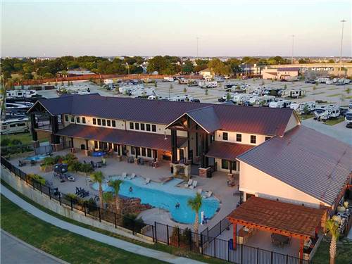 Aerial view of the swimming pool behind the main building at LAKESHORE RV RESORT
