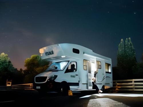 A Class C motorhome at night