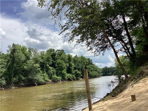 A view of the river from the sand at CHICKASAWHAY RIVER RV PARK