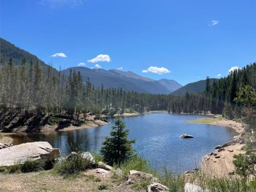 View of lake and mountains at Arapaho Valley Ranch