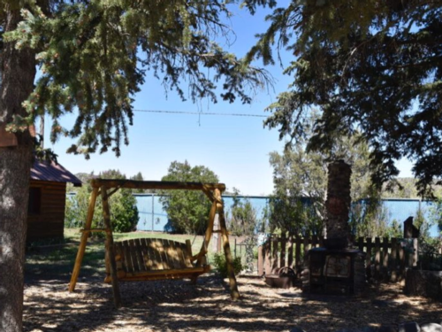 Swing under the trees at Chinook Cabins & RV Park
